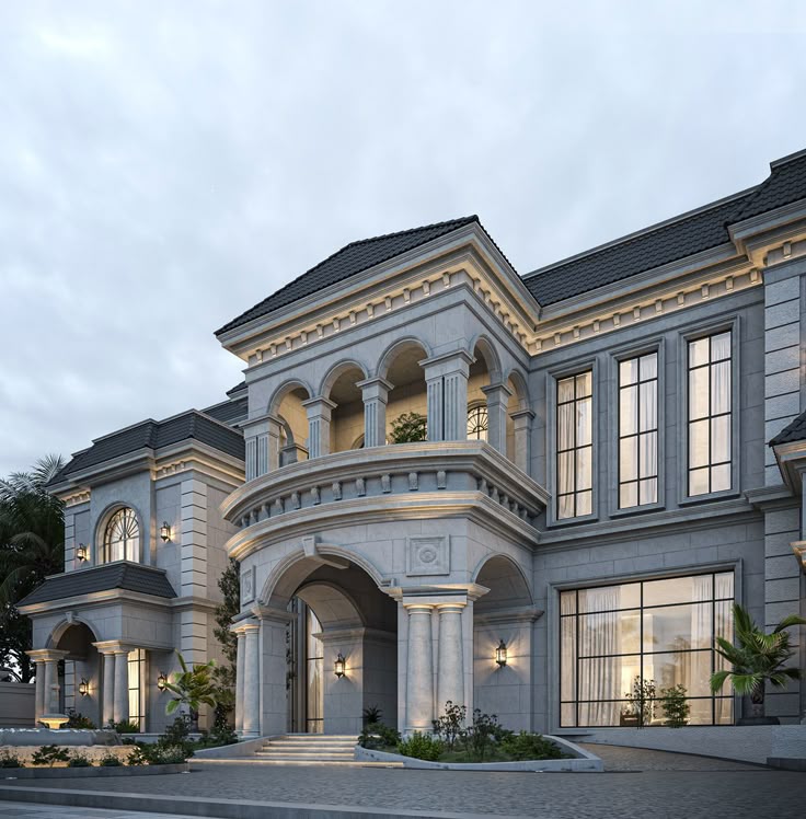Mediterranean-style villa with light stone facade and palm trees